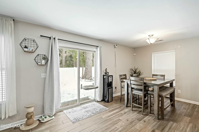 dining area with light hardwood / wood-style flooring