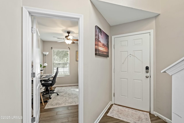 foyer with dark wood-type flooring and ceiling fan