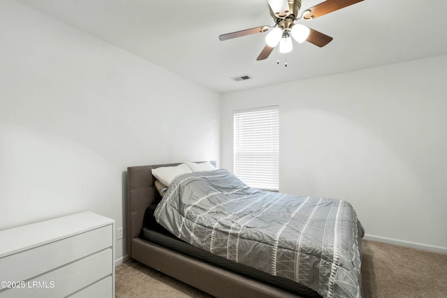 bedroom with light carpet and ceiling fan