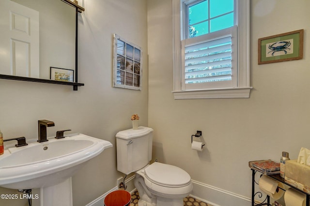 bathroom featuring sink and toilet