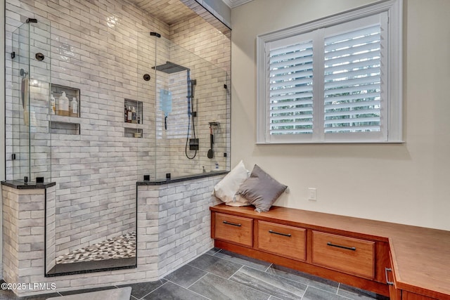 bathroom with tiled shower