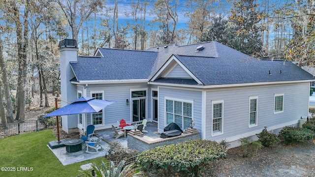 back of house featuring a yard, an outdoor hangout area, and a patio