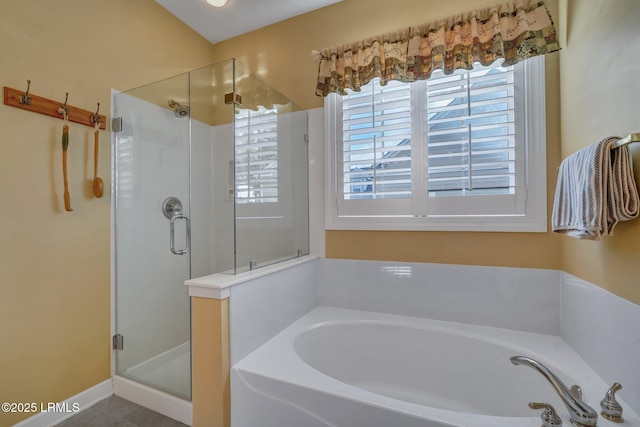 bathroom with shower with separate bathtub