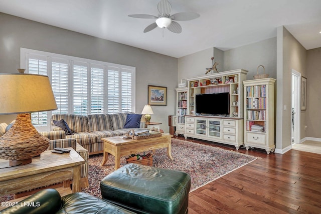 living room with dark hardwood / wood-style floors and ceiling fan