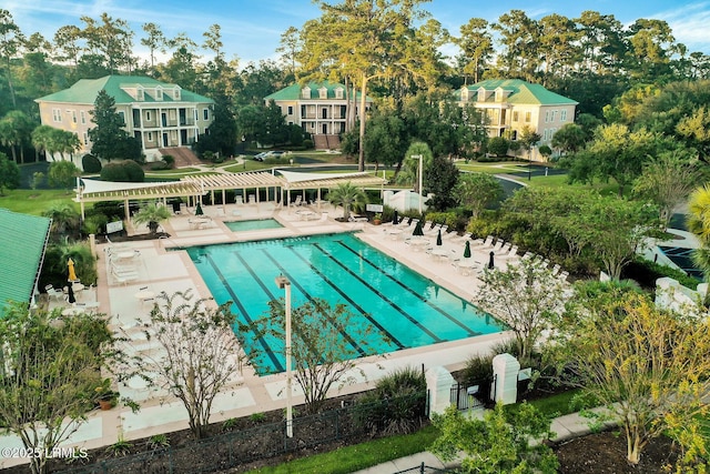 view of pool featuring a pergola and a patio