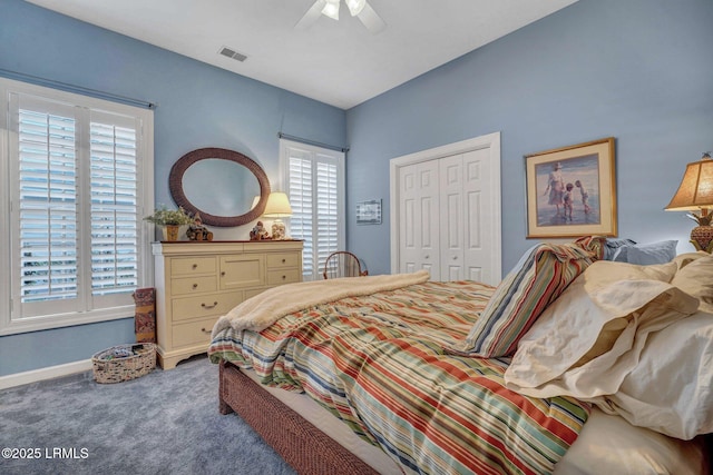 bedroom with ceiling fan, carpet floors, and a closet