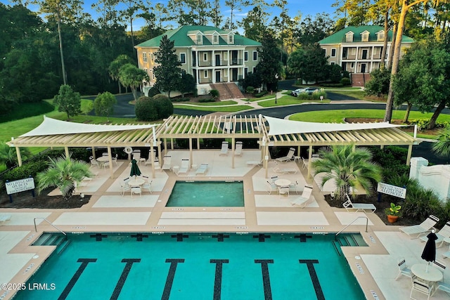 view of pool featuring a hot tub, a pergola, and a patio