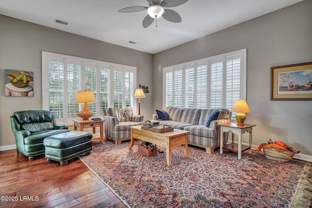 living room with hardwood / wood-style flooring and ceiling fan