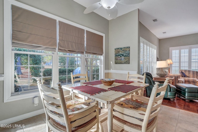 tiled dining room featuring ceiling fan