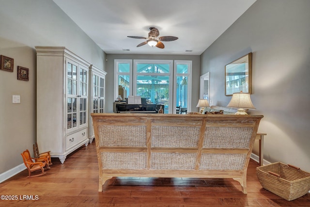 interior space with ceiling fan