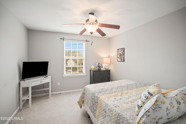 bedroom with carpet, baseboards, and a ceiling fan