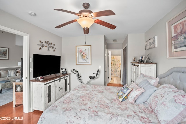 bedroom featuring ceiling fan and wood finished floors