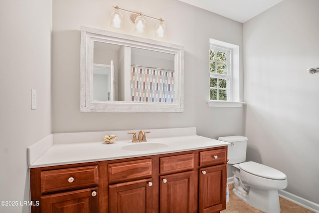 full bath with toilet, tile patterned flooring, and vanity