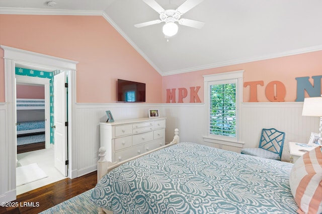 bedroom featuring ceiling fan, ornamental molding, dark hardwood / wood-style floors, and vaulted ceiling