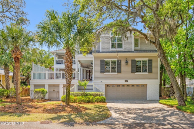 view of front of house featuring a garage and ceiling fan