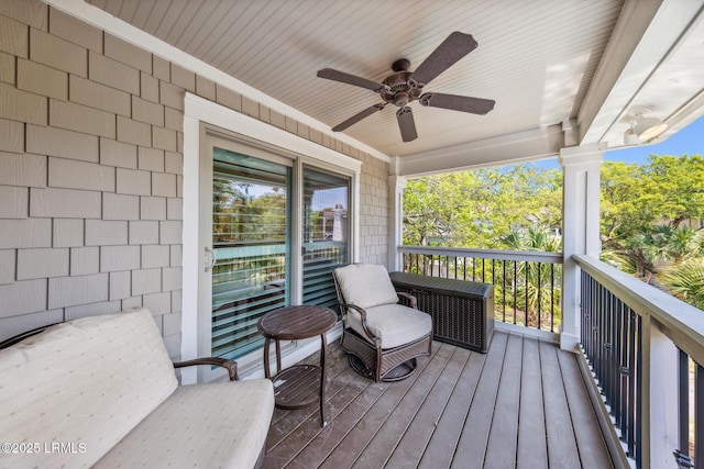 wooden terrace featuring ceiling fan