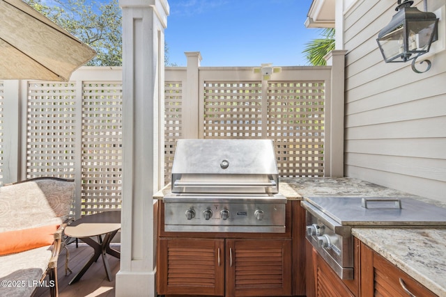 view of patio featuring grilling area and exterior kitchen