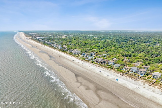 birds eye view of property featuring a view of the beach and a water view