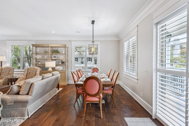 dining area featuring ornamental molding, dark hardwood / wood-style floors, and a chandelier