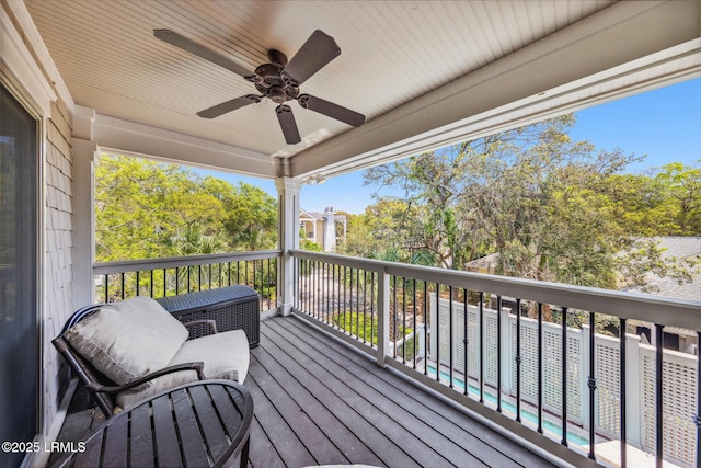 wooden deck with ceiling fan