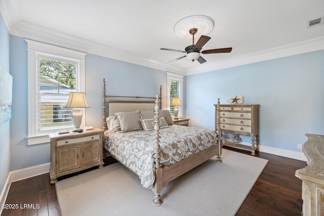 bedroom with crown molding, ceiling fan, and dark hardwood / wood-style flooring