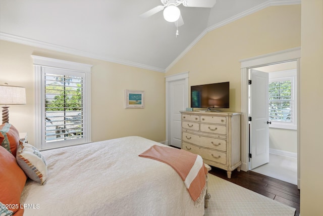 bedroom with ceiling fan, lofted ceiling, ornamental molding, and dark hardwood / wood-style floors