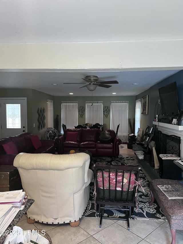 living room with light tile patterned flooring and ceiling fan