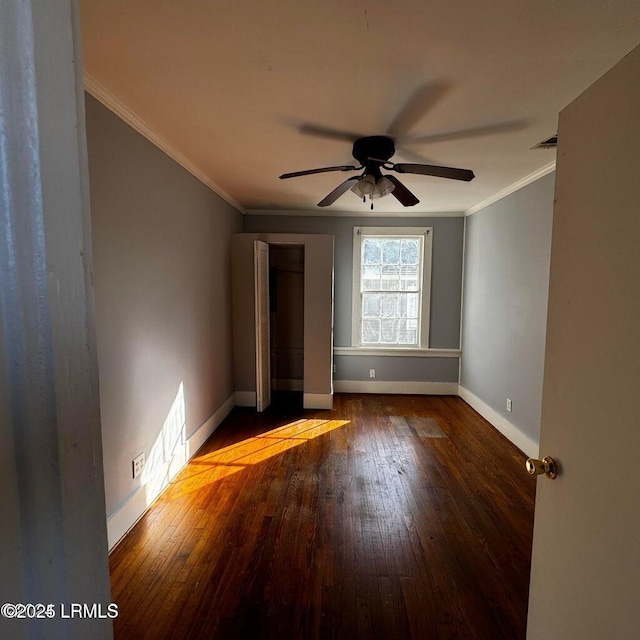 907 Duke St, Beaufort, SC 29902 - unfurnished bedroom featuring a ceiling fan, hardwood / wood-style flooring, crown molding, and baseboards