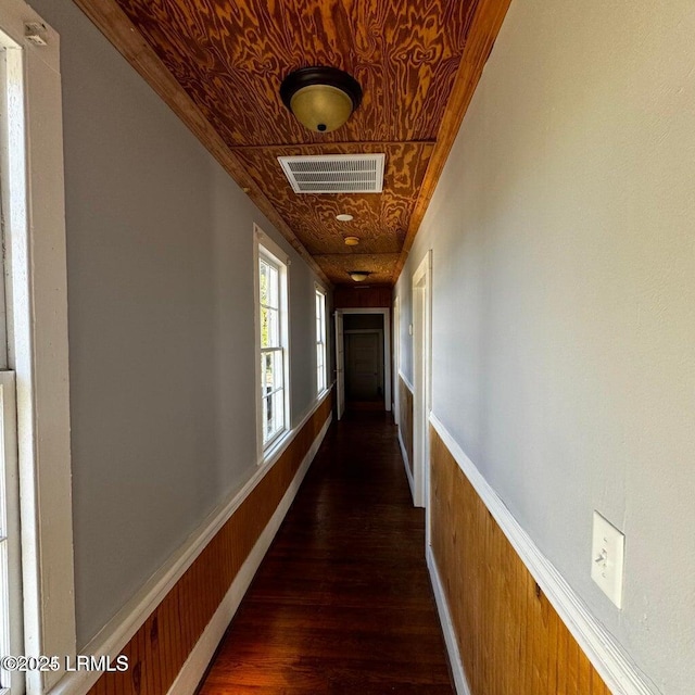 907 Duke St, Beaufort, SC 29902 - corridor featuring visible vents, wooden walls, wood finished floors, an ornate ceiling, and wainscoting