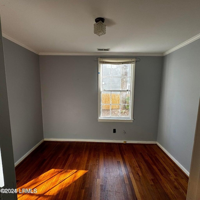 907 Duke St, Beaufort, SC 29902 - empty room with baseboards, visible vents, crown molding, and wood-type flooring
