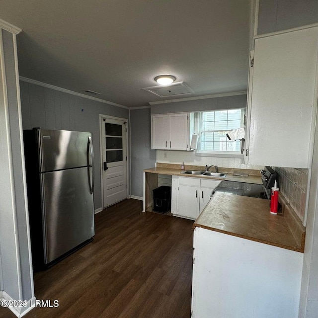 907 Duke St, Beaufort, SC 29902 - kitchen with ornamental molding, range with electric cooktop, a sink, dark wood-style floors, and freestanding refrigerator
