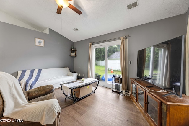 125 Harvest Cir, Bluffton, SC 29910 - living area with lofted ceiling, ceiling fan, wood finished floors, and a textured ceiling