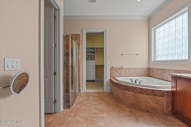 bathroom with ornamental molding, separate shower and tub, vanity, and tile patterned floors