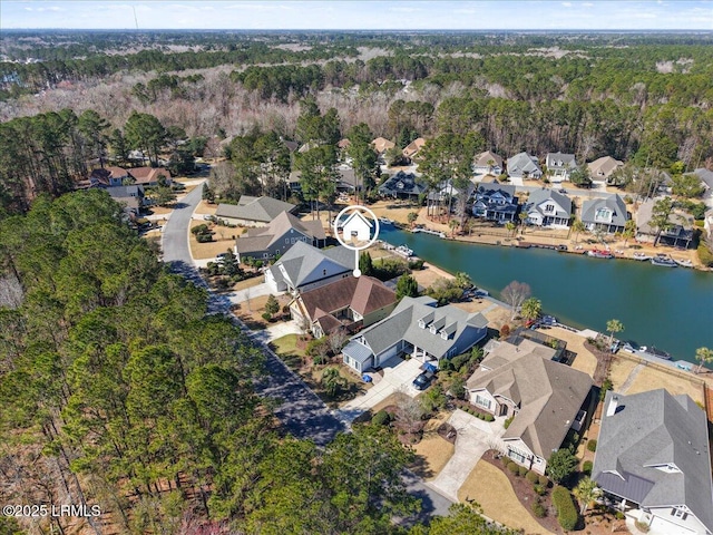 bird's eye view featuring a water view and a residential view