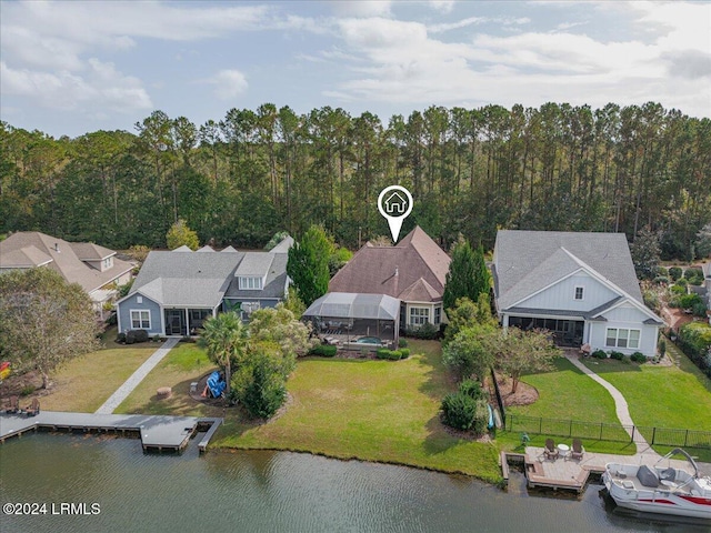 birds eye view of property featuring a water view