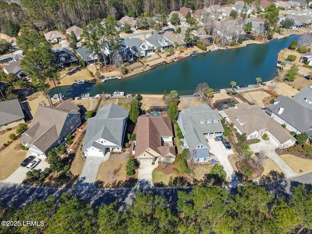 aerial view with a residential view and a water view