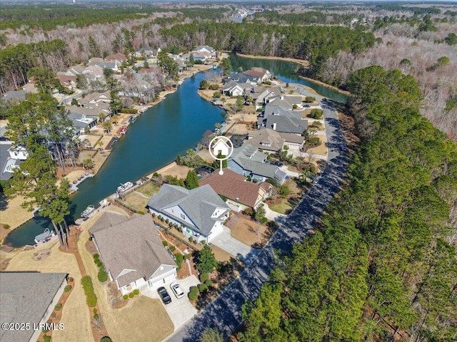 birds eye view of property featuring a water view and a residential view