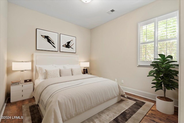 bedroom featuring dark hardwood / wood-style floors