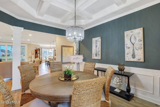 dining room with coffered ceiling, light hardwood / wood-style flooring, ornamental molding, beamed ceiling, and decorative columns