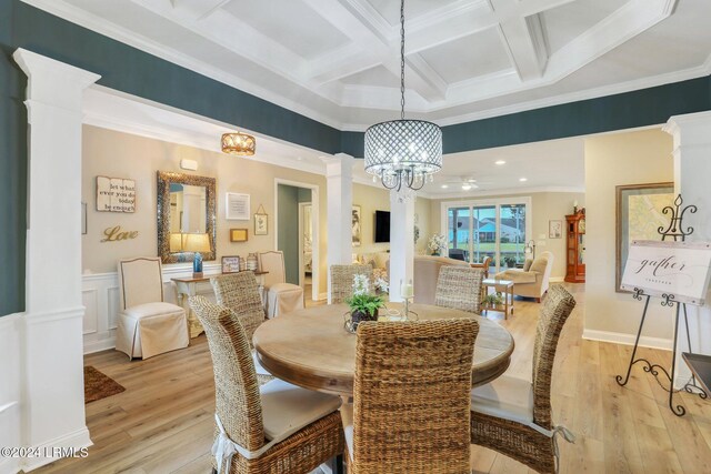 dining area with light hardwood / wood-style flooring, beam ceiling, coffered ceiling, ornamental molding, and ornate columns