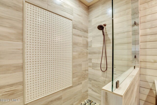 bathroom with tiled shower