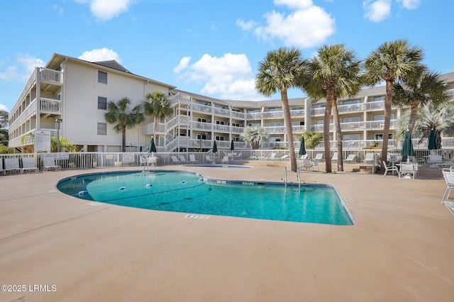 view of swimming pool featuring a patio area