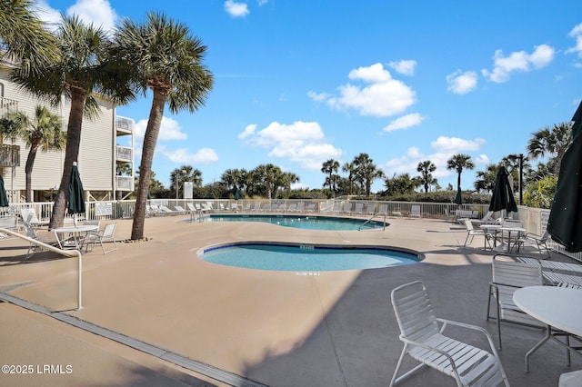 view of swimming pool with a patio