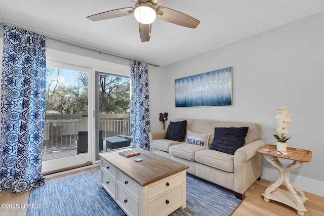 living room with hardwood / wood-style floors and ceiling fan