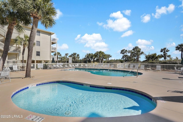 view of swimming pool featuring a patio area