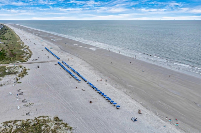 aerial view with a water view and a beach view