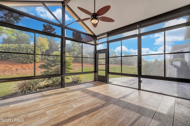 unfurnished sunroom featuring ceiling fan and lofted ceiling