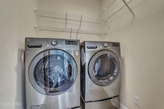 laundry area with washer and clothes dryer