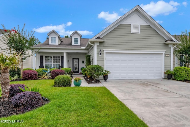 view of front of home with a garage and a front lawn