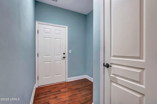 doorway with dark hardwood / wood-style flooring